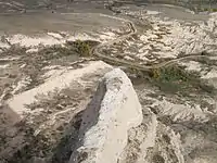 Looking down at road and irrigation ditch to the northeast from Scotts Bluff National Monument