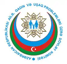 Committee logo, a man, woman and child inside a blue, red and green Islamic crescent