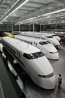 Preserved car 323-20 (foreground) and 322-9001 at SCMaglev and Railway Park in March 2011