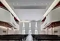 Historic church windows as seen from the interior of the new service hall, ca. 2019.