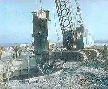 Image 32Ukrainian workers use equipment provided by the U.S. Defense Threat Reduction Agency to dismantle a Soviet-era missile silo. After the end of the Cold War, Ukraine and the other non-Russian, post-Soviet republics relinquished Soviet nuclear stockpiles to Russia. (from Nuclear weapon)