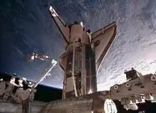 Discovery shortly after docking with the International Space Station on 26 February 2011.