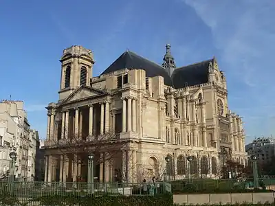 The classical west facade (left), the traditional entrance, with its unfinished tower