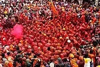 Colour drenched devotees in Radha Krishna Temple, Mathura, India.