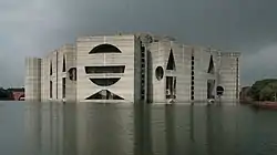 Facade of building across artificial lake