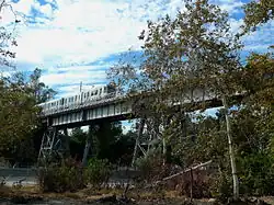 Santa Fe Arroyo Seco Railroad Bridge with a Gold line Tram crossing, this the 3rd bridge at the site of the original 1886 Los Angeles and San Gabriel Valley Railroad bridge, 2013