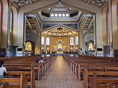 The nave and sanctuary with the La Naval de Manila image enshrined at the main altar