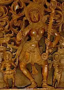 Sarasvati with a fretted kinnari vina, with an apparent makara or yali on the top. Fretted tube-zither vinas are mentioned in literature by 800 C.E., coexisting with the non-fretted vinas. The rudra veena descends from the kinnari veena.