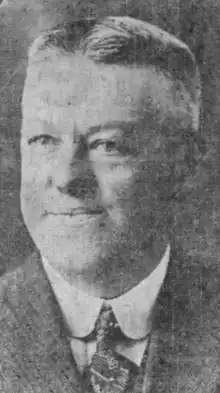 Black and white photograph of Betts in a suit and tie