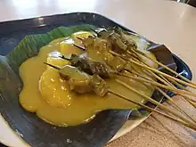 Sate Padang with yellow sauce