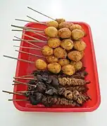 Quail eggs and intestine satays