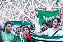 Image 12Saudi football fans cheering for their national football team at the FIFA World Cup (from Culture of Saudi Arabia)