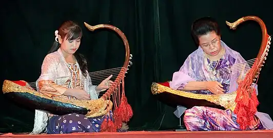 Image 29Two female musicians play the saung at a performance in Mandalay. (from Culture of Myanmar)