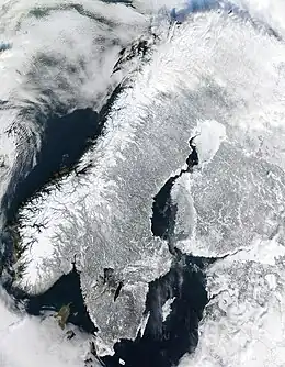 Image 6Scandinavian PeninsulaPhoto credit: MODIS Rapid Response Project, NASAA satellite image of the Scandinavian Peninsula in winter. The peninsula, approximately 1,850 kilometers (1,150 miles) long with a width varying between approximately 370–805 km (230–500 mi), making it the largest in Europe, is located in the northern part of the continent and consists of Norway, Sweden and part of Finland. Much of the population is concentrated in the southern part of the peninsula; Stockholm and Gothenburg, both in Sweden, and Oslo in Norway are the largest cities.More selected pictures