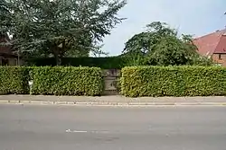 A road in Rade with the memorial to  its dead in the two world wars