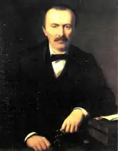 Oil painting of a balding, moustachioed man in formal dress.