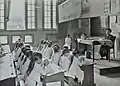 Tailoring class in a colonial school in Hanoi.