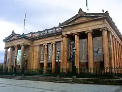 Twin porticoes at the main entrance with the original name inscribed on the frieze.