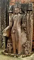 Relief "standing figure of Manjushri" in the Buddhist temple.