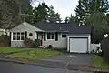 3146 NE 83rd Street in the Wedgwood neighborhood, a typical Cape Cod with attached garage.