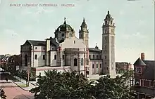 This early postcard of St. James Cathedral (Roman Catholic, built 1907) shows it with its original dome; the dome collapsed from snow in 1916 and was never rebuilt.