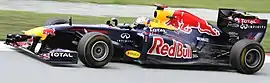 Sebastian Vettel driving the Red Bull RB7 at the 2011 Malaysian Grand Prix.