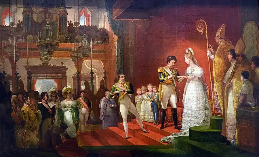 A man in uniform places a ring on the finger of a woman in an elaborate white dress. Four small children stand behind him.