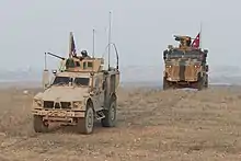 U.S. and Turkish forces conduct joint patrols on the outskirts of Manbij, Syria, 8 November 2018