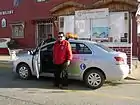 A Seguridad Ciudadana employee with their patrolling car, in May 2010.