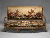 Louis XVI settee; designed in circa 1786, woven 1790–91, settee frame from the second half 19th century; carved and gilded wood, with wool and silk; 107.3 × 191.5 × 71.1 cm; Metropolitan Museum of Art