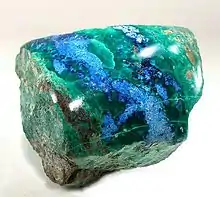 Polished shattuckite with malachite, New Cornelia mine, Ajo, Arizona. Size 5.3 × 5.1 × 5.0 cm