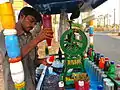 A man preparing shaven ice in India