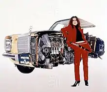 A woman in a red leather suit with a katana stands beside a brown Mercedes-Benz W114, cut entirely in half. The number plate reads "Преступлéние и наказáние," the Cyrillic title of Fyodor Dostoyevsky's novel Crime and Punishment.