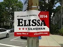 A red and white sign with the name "Elissa" large and in black.