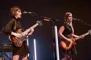 Sleater-Kinney performing in 2019. L-R: Brownstein, Tucker