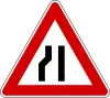 Road narrows on left side