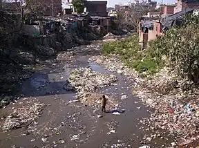 Image 3Poverty often leads to unhygienic living conditions, as in this community in the Indian Himalayas. Such conditions promote contraction of diarrheal diseases, as a result of contaminated drinking water, poor sanitation and hygiene. (from Drinking water)