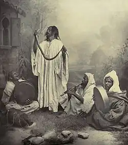 Image 4Snake charmingPhoto: Tancrède Dumas; Restoration: Lise BroerA late nineteenth century photo of snake charmers in Tangier, Morocco. Snake charming is the practice of apparently hypnotising a snake, and the performance may use musical instruments and other street performance techniques. The practice as it exists today probably arose in India, where it remains widely practiced, and spread throughout Southeast Asia, the Middle East, and North Africa.More selected pictures