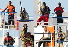 Image 22A collage of Somali pirates armed with AKM assault rifles, RPG-7 rocket-propelled grenade launchers and semi-automatic pistols in 2008 (from Piracy)