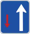 The traffic moving in the direction of the white arrow is given priority