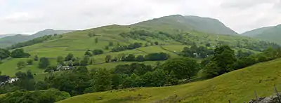 Looking up the broad south ridge of Red Screes to Snarker Pike and the summit, from near Ambleside.