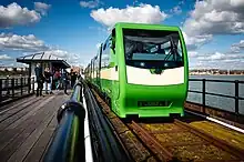 A new Severn Lamb-built train runs along the Southend Pier Railway towards Pier Head Station in April 2023.