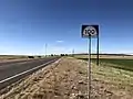 SR-100 midroute reassurance without directional banner, just beyond the 90° turn near Flowell. This one is facing northbound (westbound) traffic (May 2020)