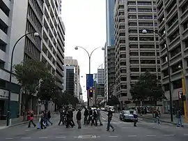 Three lane each way road in between office buildings