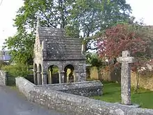 Fig. h7: St Cleer's holy well, with its stone cross