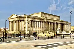 St George's Hall, long neo-classical building with multiple portico sets.