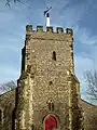 The tower, incorporating stones and blocks of Norman origin