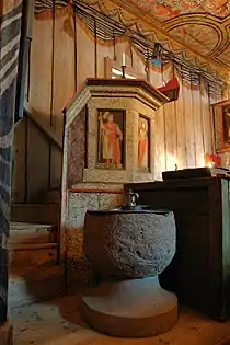 Baptismal font and pulpit.