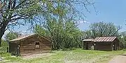 The stables and an outhouse.