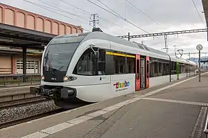 White train at side platform